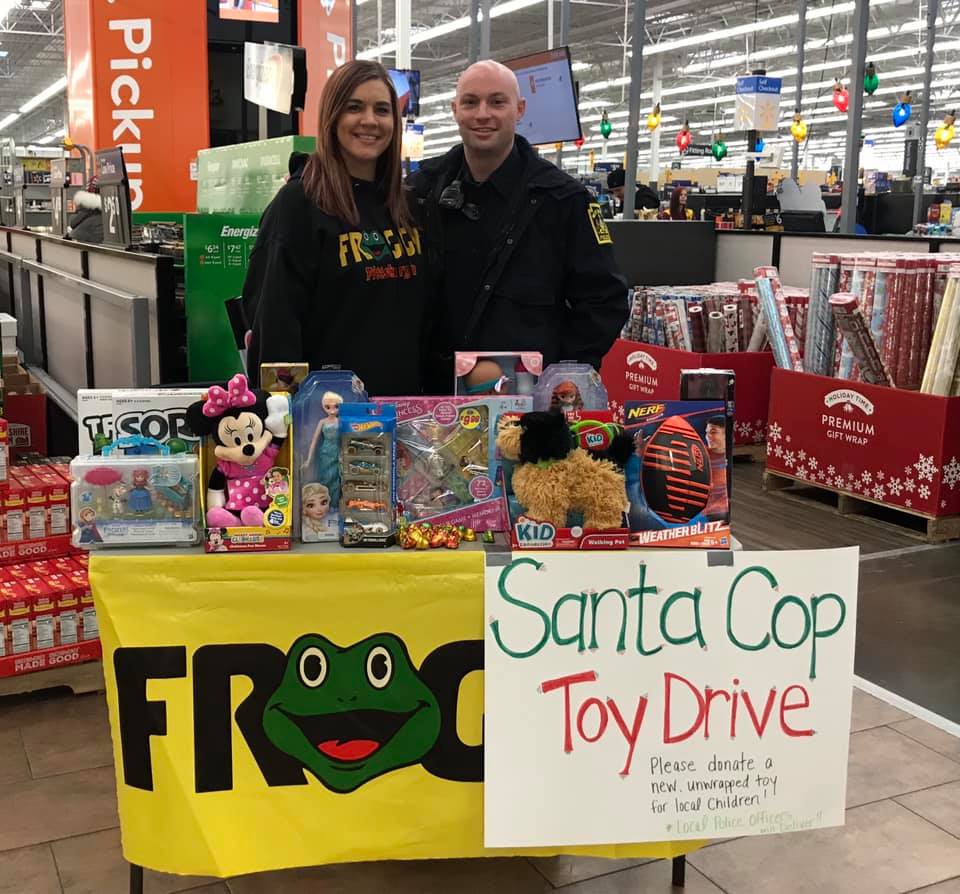 Froggy’s Aligator collecting toys with Santa Cop
